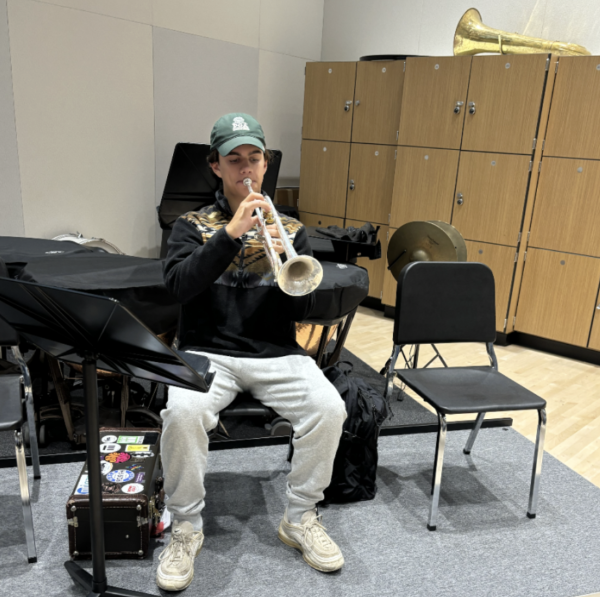 Senior Theo Schonberg practicing for ILMEA Jazz instrumental auditions on the trumpet